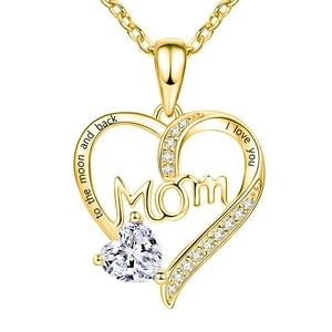Detail of gold heart pendant necklace with MOM letters and clear crystal stones