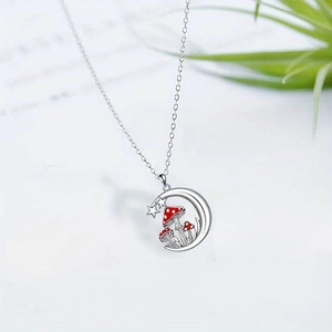Silver crescent moon necklace with red mushroom pendants and small stars for women