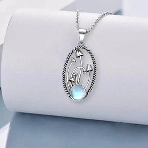 Retro mushroom necklace with silver hollow oval pendant and blue moonstone detail