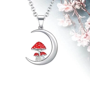 Detailed close-up of crescent moon necklace with small red and white enamel mushrooms