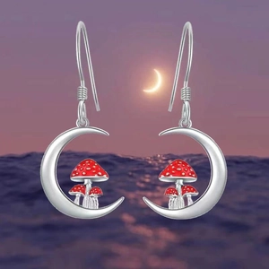 Detailed view of S925 sterling silver hook earrings with moon and red mushroom charm