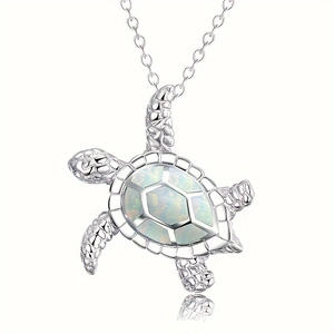 Silver turtle pendant necklace with white opal shell and detailed nautical animal design