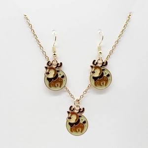 Detail view of cartoon reindeer jewelry set with gold necklace and matching drop earrings