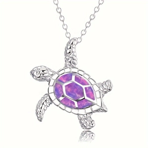 Cute sea turtle pendant necklace with purple and pink opal stones on a silver chain