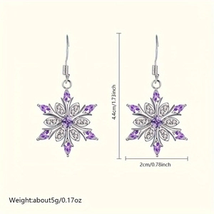 Macro shot of silver snowflake earrings with purple zircon and measurement markings