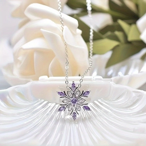 Elegant silver snowflake necklace with purple center stone and white zircon accents