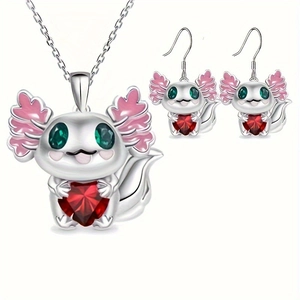 Detail of axolotl jewelry set featuring heart-shaped red gems and green stone eyes