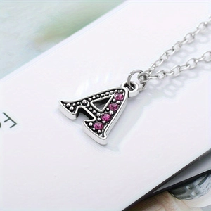 Silver letter A pendant necklace with pink rhinestones and vintage beaded edge decoration