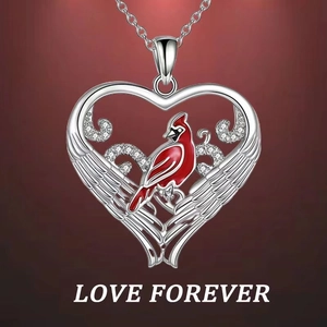 Silver heart pendant necklace with red cardinal and feather texture on red background