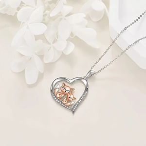 Fashionable heart necklace with silver and rose gold foxes and sparkling zircons
