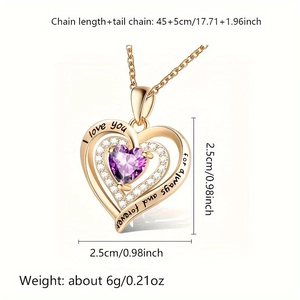 Close-up of rose gold heart pendant with purple gemstone and romantic engraving