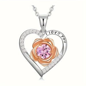 Detail of heart necklace with rose gold flower and I love you engraving on silver band