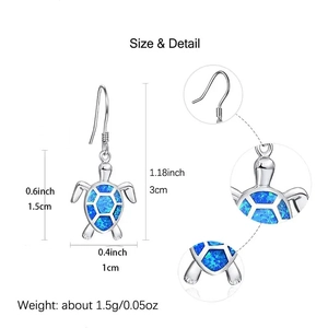 Detailed view of silver sea turtle earrings featuring blue opal inlay and dimensions