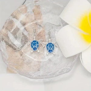 Blue opal sea turtle drop earrings with silver finish and sparkling oceanic design