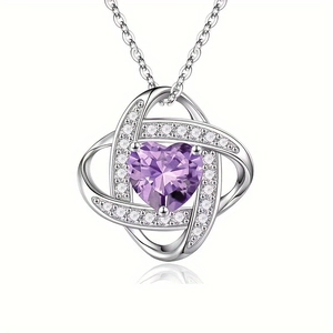 Macro view of purple heart cut gemstone pendant with twisted silver pavé setting
