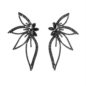 Detailed view of silver leaf-shaped earrings featuring black rhinestones and marquise accents