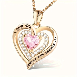 Macro shot of rose gold heart necklace with pink crystal and I love you forever engraving