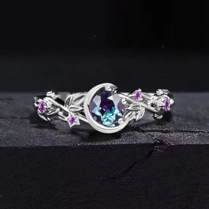 Elegant crescent moon and leaf ring with round color-changing gem and star accents