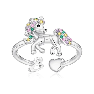 Detail of unicorn open ring featuring colorful zircon crystals and heart charm