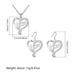 Detailed view of silver heart necklace and earrings set with I Love You Mom engraving