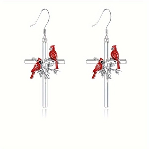Creative cross and cardinal bird earrings with silver branch and leaf leaf details