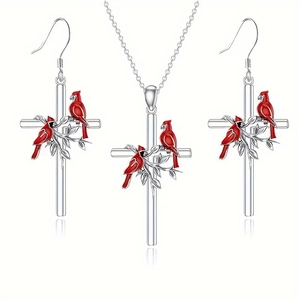 Artistic cross necklace and earrings set with climbing leaves and red cardinal birds