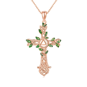 Rose gold tree of life cross necklace with green enamel leaves and Celtic knot pendant