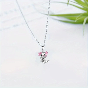 Cute pink axolotl pendant necklace with silver chain on a minimalist light background