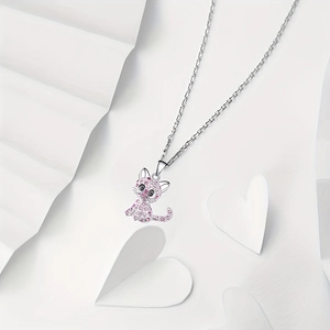 Close-up of cute pink crystal pavé cat pendant necklace on elegant gift backdrop