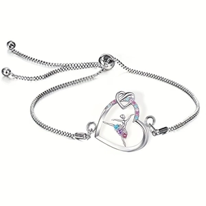 Detailed view of adjustable silver heart bracelet with a dancing ballerina and colorful crystals
