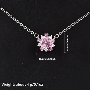 Macro shot of pink cherry blossom pendant with dimensions 10.2mm and weight 4g