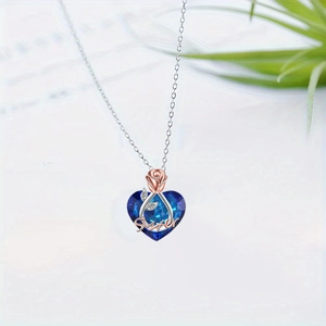 Collana con cuore di cristallo blu, fiore in oro rosa e incisione Sister per donna