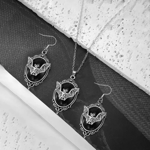 Gothic vampire bat jewelry set with black gemstone necklace and matching hook earrings