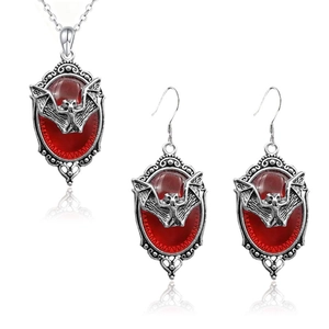 Gothic vampire bat jewelry set featuring red gemstone inlay and vintage silver finish