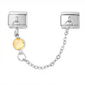 Close-up of 9mm Italian charm bracelet safety chain with bright yellow faceted gemstone