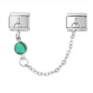 Macro detail of 9mm Italian charm bracelet link with silver chain and green gemstone