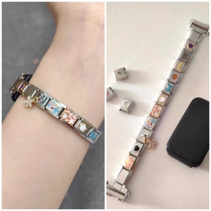 Detail of 9mm stainless steel modular charm links with star, flower and moon motifs