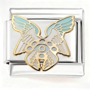 Detail of Italian charm bracelet link featuring a winged eye motif in blue and gold enamel