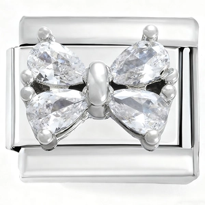 Macro shot of stainless steel Italian charm link featuring a crystal bow tie design