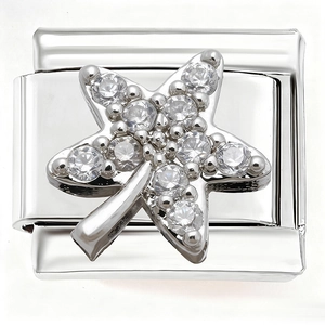 Close-up of a silver charm link with a star-shaped element inlaid with clear zircons