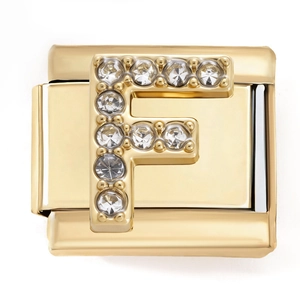 Macro shot of Italian modular gold charm featuring a sparkling zircon letter F detail