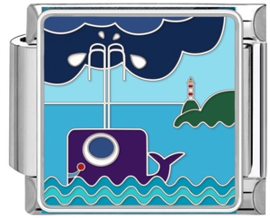 Macro shot of stainless steel modular charm with whale and lighthouse enamel art