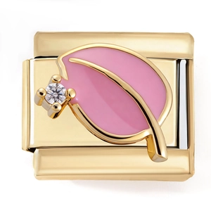 Macro shot of gold stainless steel Italian charm link with pink leaf and zircon