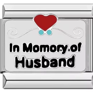 Macro shot of silver stainless steel charm with heart and In Memory of Husband text