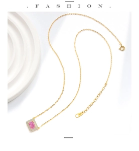 Detail of S925 silver necklace featuring a pink sugar cube pendant with micro-inlaid stones