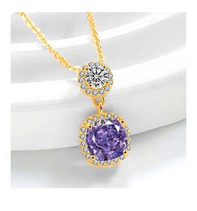 Macro shot of gold necklace with a square purple gemstone and pave-set diamonds detail