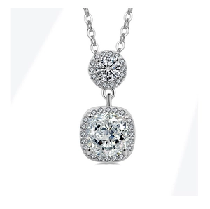 Detailed macro view of double diamond pendant necklace with cushion cut stones