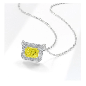Macro view of S925 silver necklace featuring a rectangular ice-cut yellow gemstone pendant