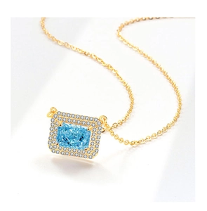 Detailed macro view of S925 silver necklace with emerald cut blue crystal pendant