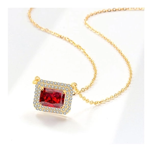 Macro detail of S925 silver necklace with rectangular red gemstone and crystal halo